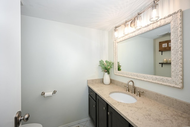 bathroom featuring vanity and baseboards