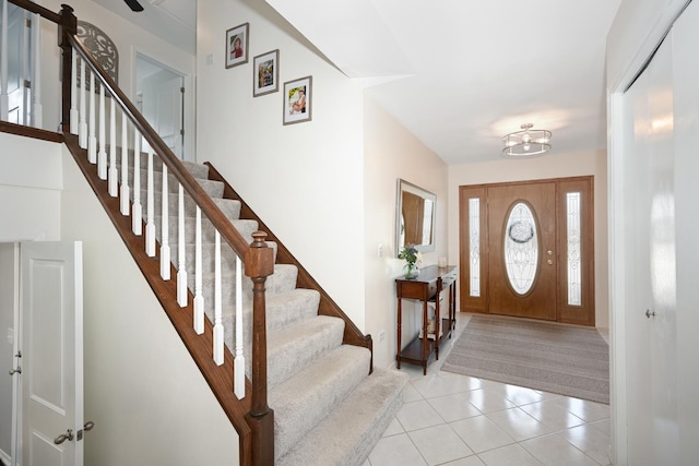 tiled entryway with stairs