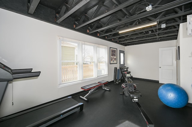 workout area featuring baseboards