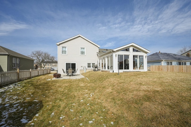 back of house featuring a yard, fence, a patio area, and an outdoor fire pit