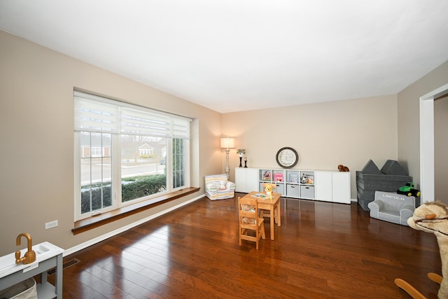 dining room with visible vents, baseboards, and wood-type flooring