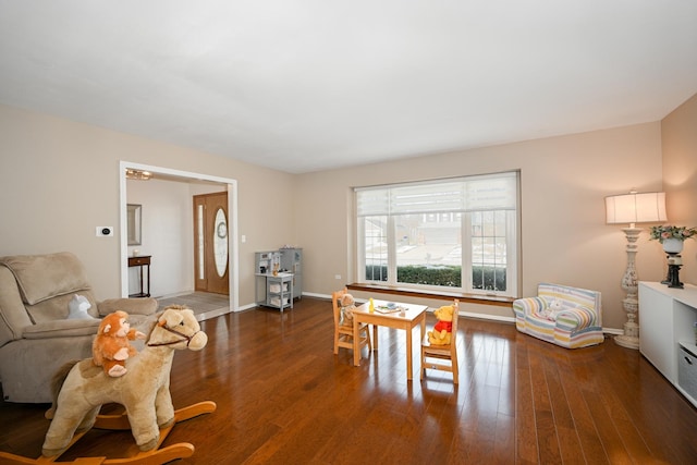 dining room featuring wood finished floors and baseboards