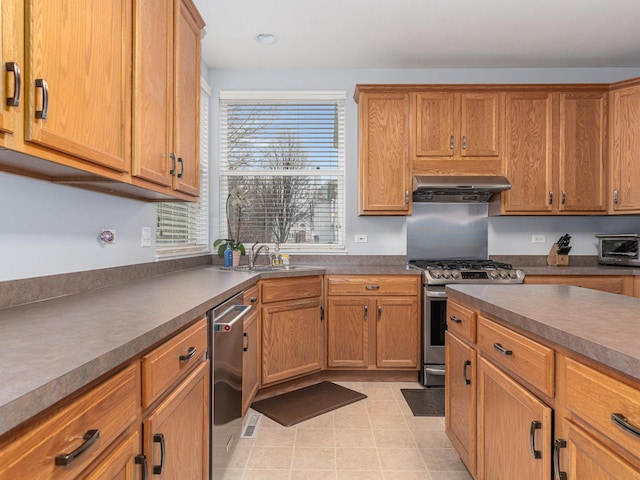 kitchen with ventilation hood, stainless steel appliances, dark countertops, and a toaster