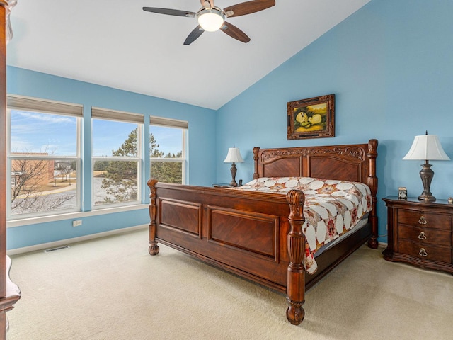 carpeted bedroom featuring vaulted ceiling, a ceiling fan, visible vents, and baseboards