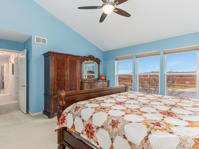 bedroom with a ceiling fan, baseboards, visible vents, vaulted ceiling, and light carpet