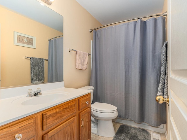 bathroom featuring vanity, a shower with curtain, visible vents, tile patterned floors, and toilet