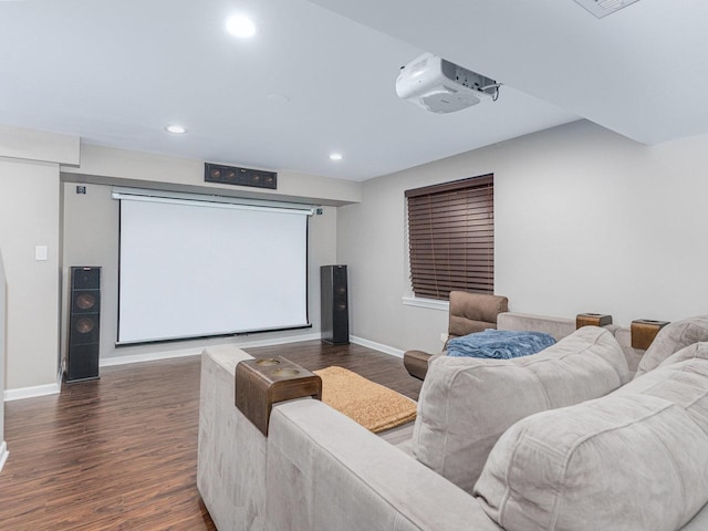 home theater room featuring recessed lighting, wood finished floors, and baseboards