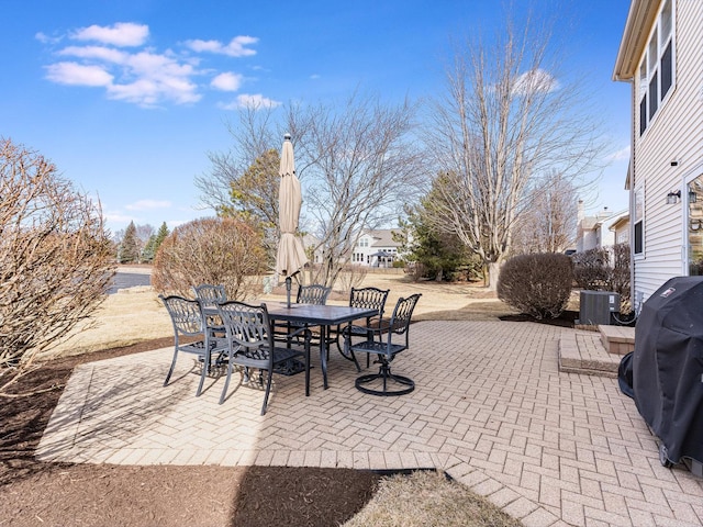 view of patio / terrace featuring grilling area, cooling unit, and outdoor dining area