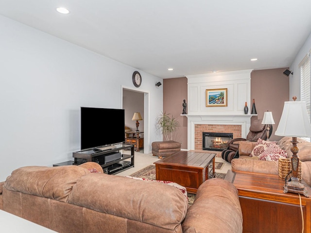 living room featuring recessed lighting, light colored carpet, and a fireplace