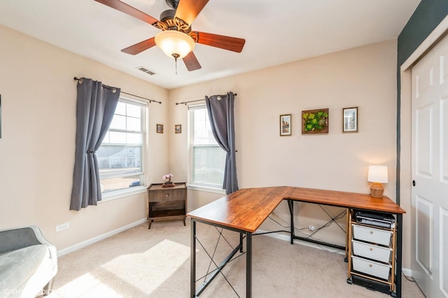 office area featuring visible vents, ceiling fan, baseboards, and carpet