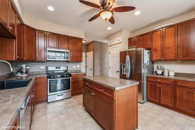 kitchen with a sink, recessed lighting, a ceiling fan, and stainless steel appliances