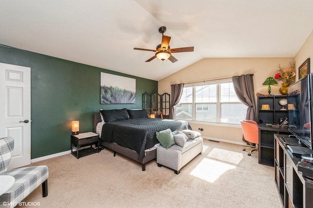 bedroom with vaulted ceiling, baseboards, and carpet floors