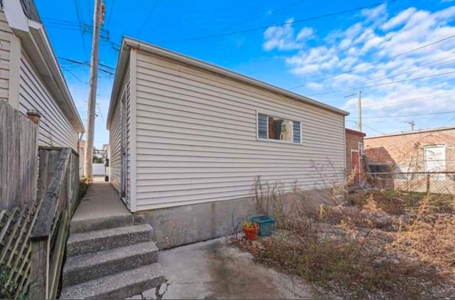 view of side of property with fence