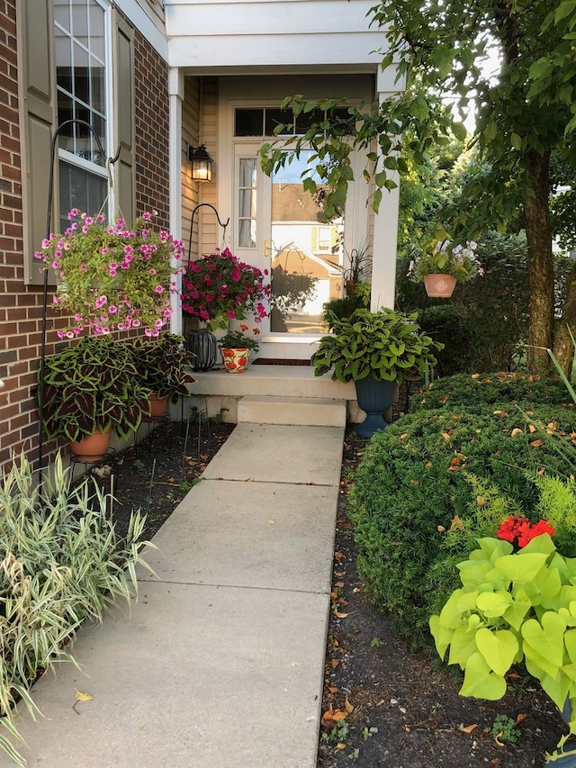 property entrance with brick siding