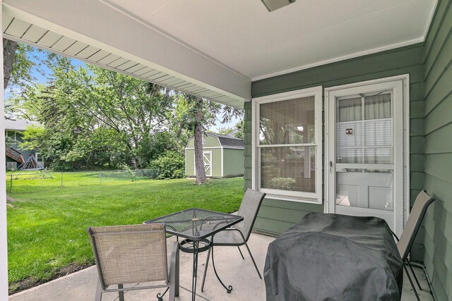 1405 Newcastle Ln, Hoffman Estates, IL 60169 - view of patio / terrace featuring outdoor dining space and a storage unit