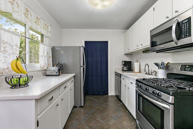 1405 Newcastle Ln, Hoffman Estates, IL 60169 - kitchen with stainless steel appliances, tasteful backsplash, light countertops, and white cabinets