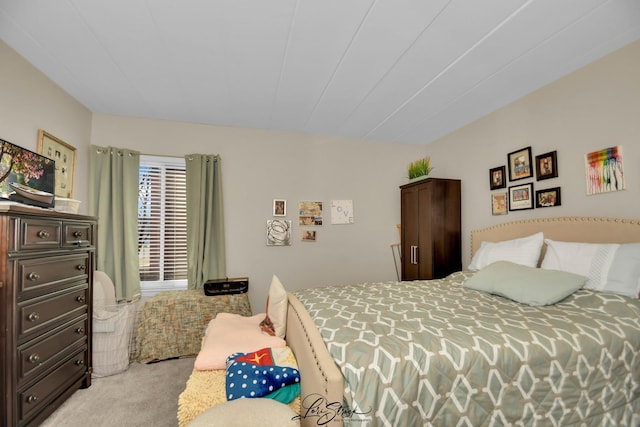 bedroom featuring light colored carpet