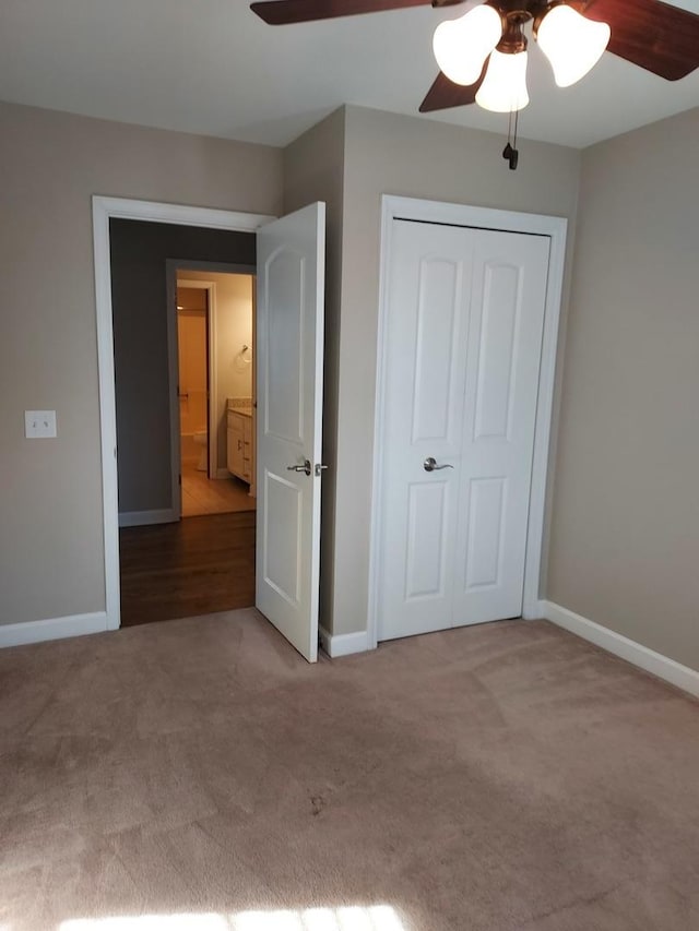 unfurnished bedroom with baseboards and carpet floors