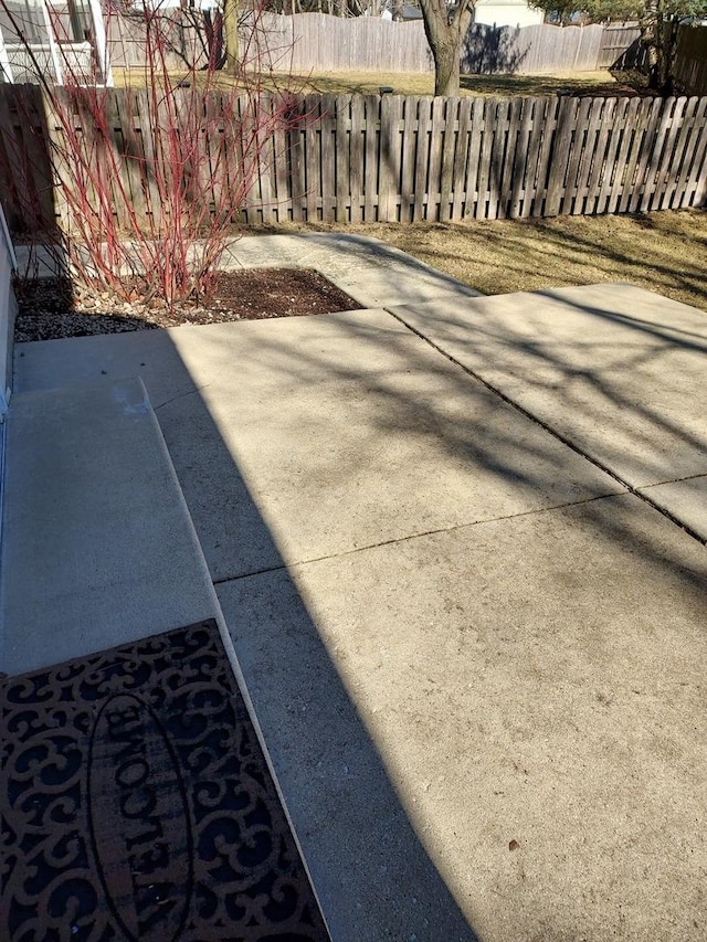 view of patio / terrace featuring fence