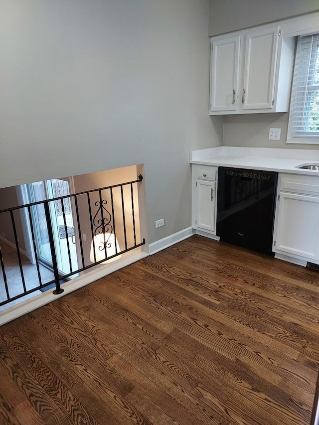 interior space featuring dark wood finished floors and baseboards