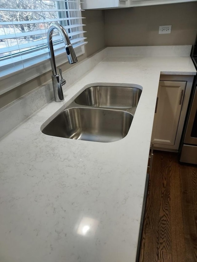 room details featuring light countertops and a sink