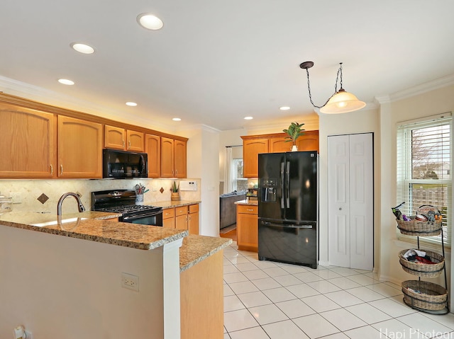 kitchen featuring black appliances, backsplash, crown molding, light stone counters, and recessed lighting