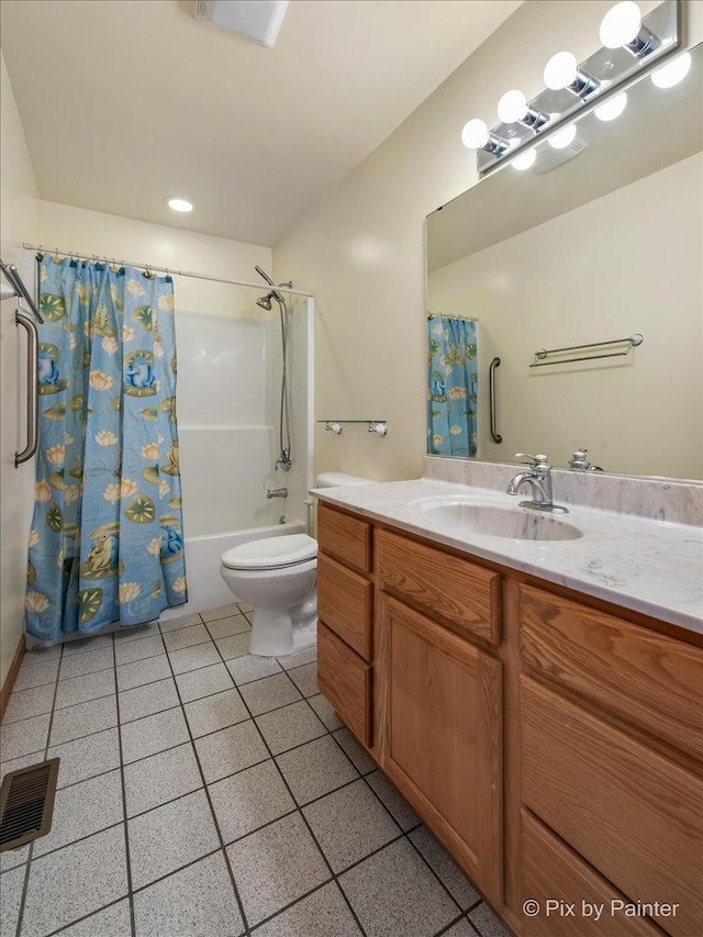 bathroom with vanity, visible vents, tile patterned flooring, shower / bath combo with shower curtain, and toilet