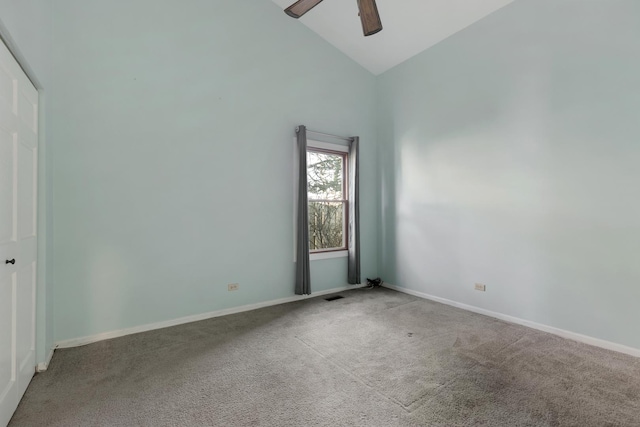 unfurnished room with high vaulted ceiling, a ceiling fan, baseboards, and carpet floors