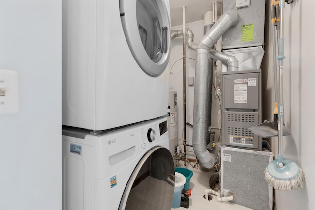 washroom featuring laundry area and stacked washer / drying machine