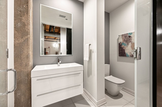 bathroom with visible vents, baseboards, toilet, tile patterned floors, and vanity