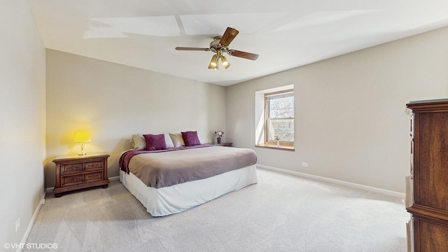 carpeted bedroom with a ceiling fan and baseboards