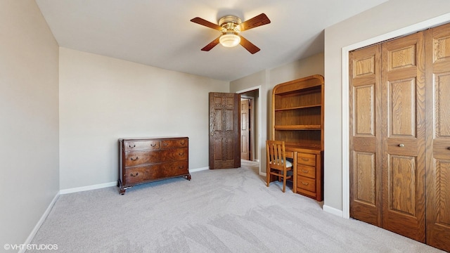 bedroom with baseboards, light colored carpet, and a ceiling fan