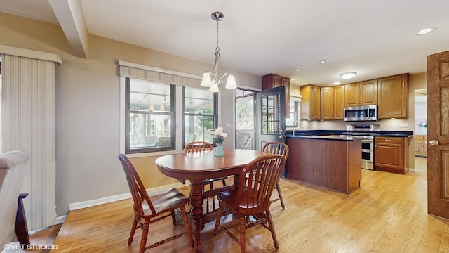 dining area with recessed lighting, baseboards, and light wood-style flooring