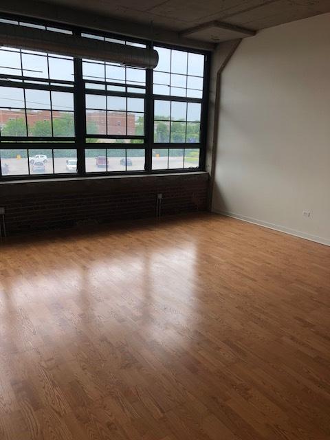 empty room featuring wood finished floors and baseboards