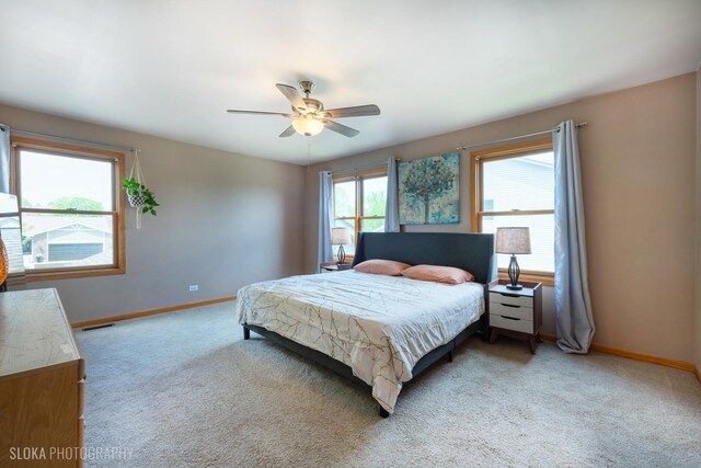 bedroom with carpet floors, baseboards, and ceiling fan