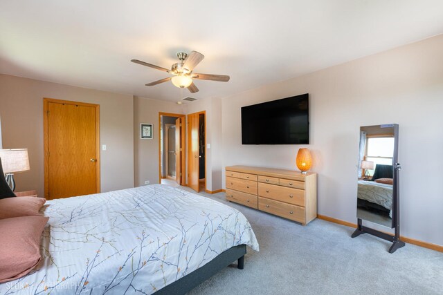 bedroom featuring baseboards, light carpet, and a ceiling fan