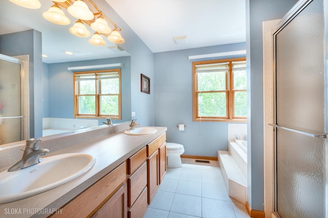 bathroom featuring plenty of natural light, a garden tub, baseboards, and a stall shower