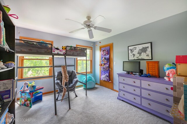 bedroom featuring carpet floors, baseboards, and ceiling fan