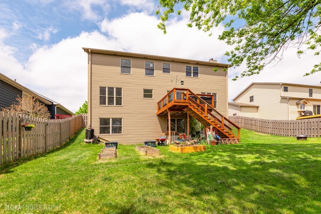 back of house featuring stairs, a wooden deck, central AC, and a chimney