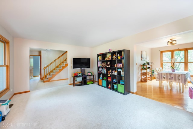game room featuring carpet flooring and baseboards