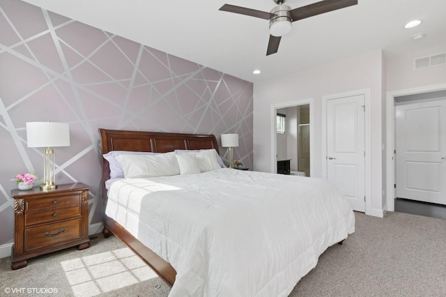 bedroom featuring a ceiling fan, light carpet, baseboards, visible vents, and recessed lighting