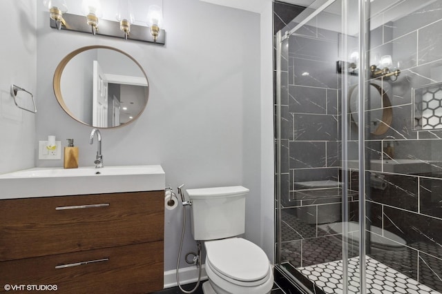 full bath with baseboards, a shower stall, toilet, and vanity