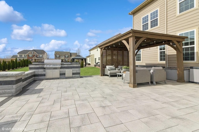 view of patio with a residential view, an outdoor hangout area, a gazebo, and area for grilling