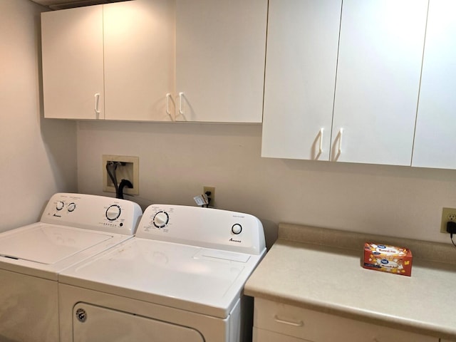 laundry area featuring cabinet space and washing machine and clothes dryer