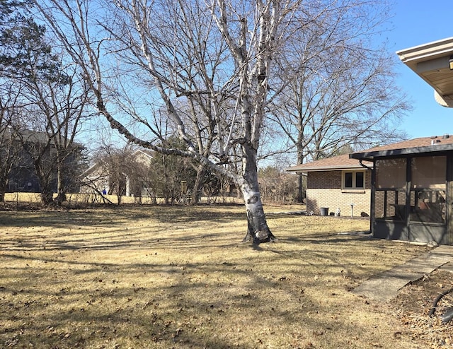 view of yard with a sunroom