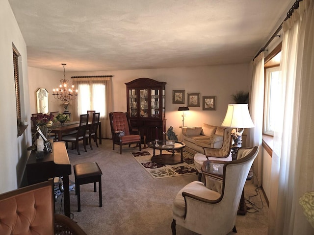 living room featuring a chandelier and carpet flooring