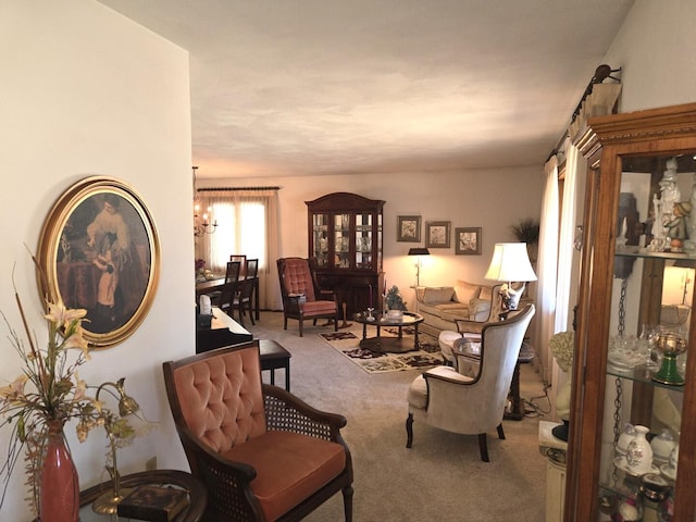 living area with carpet and a chandelier