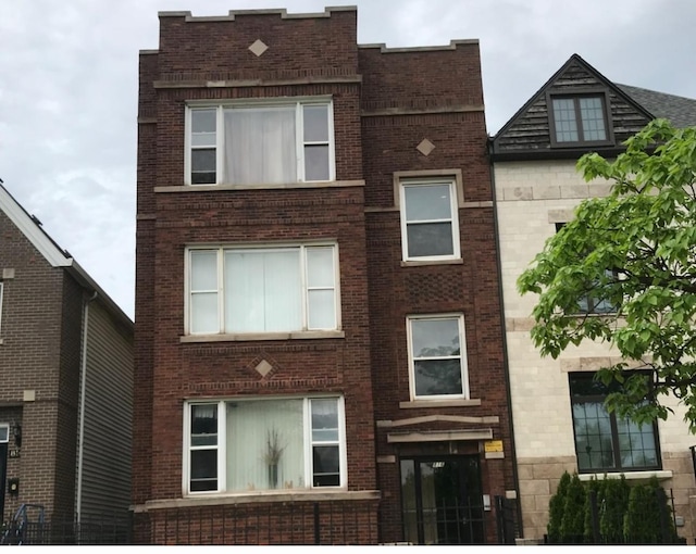 view of front of home with brick siding