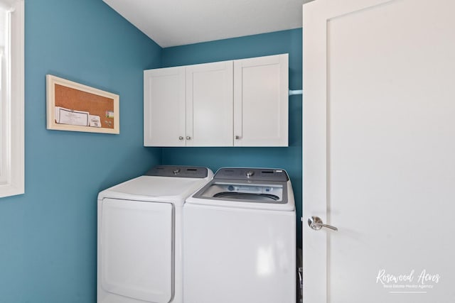 laundry area with cabinet space and independent washer and dryer