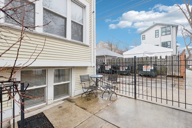 view of patio / terrace featuring fence